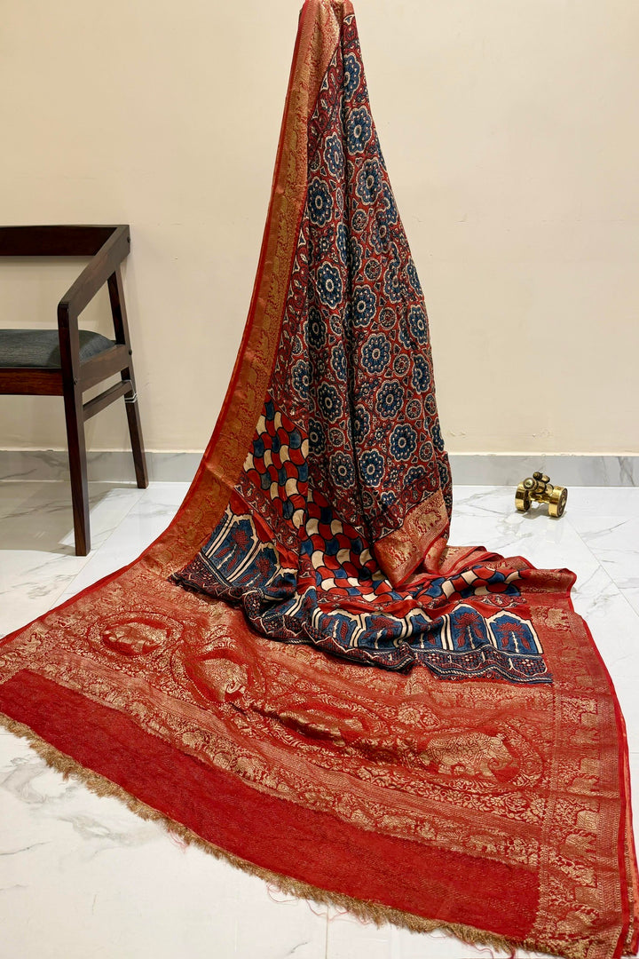 Red Dola Silk Ajrakh Print Saree with Floral Motifs & Rich Gold Zari Wedding Border