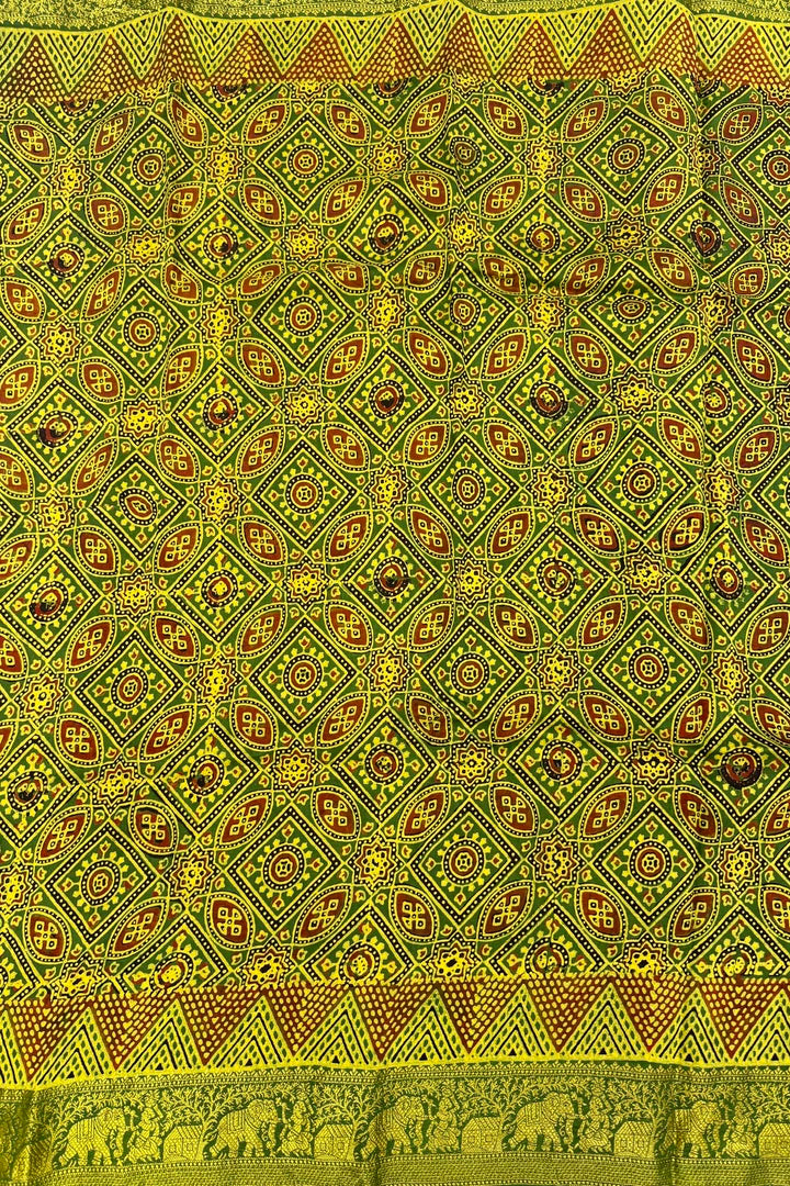Emerald Green Dola Silk Ajrakh Saree with Geometric Motifs & Gold Zari Border