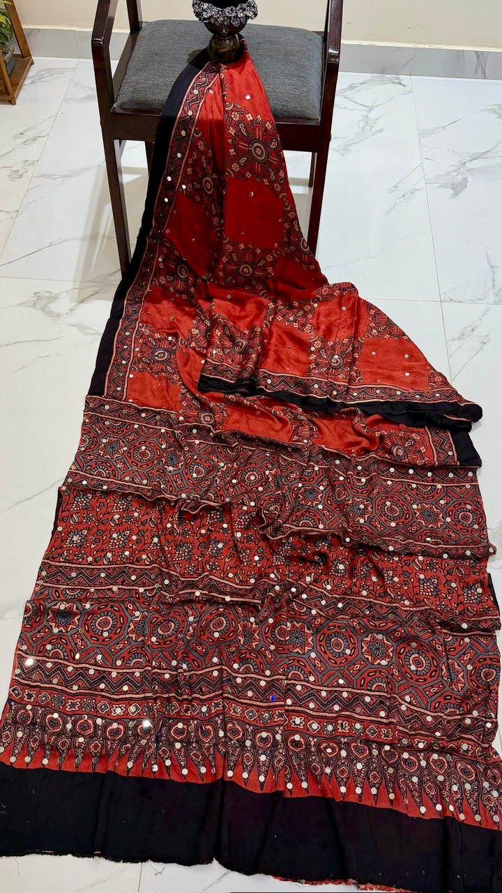 Pure Modal Silk Ajrakh Print Saree in Brick Red and Black with Mirror Work
