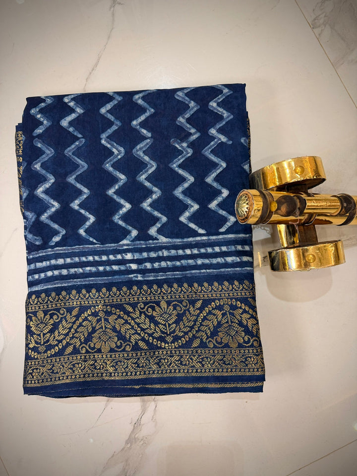 Premium Indigo Blue Dola Silk Saree with Traditional Handblock Zig-Zag Prints and Golden Zari Border.