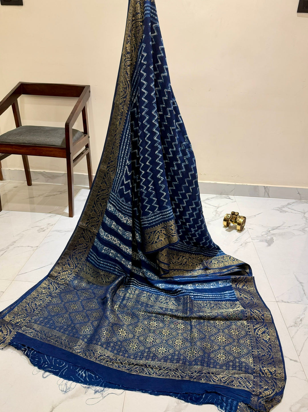 Premium Indigo Blue Dola Silk Saree with Traditional Handblock Zig-Zag Prints and Golden Zari Border.
