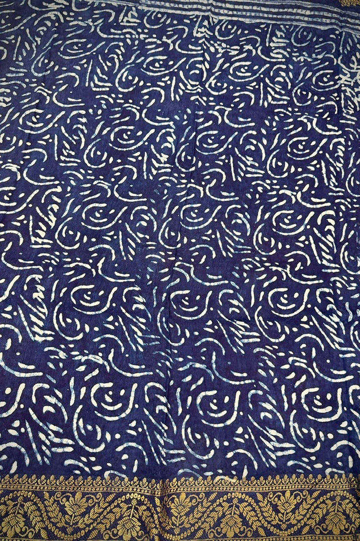 Premium Indigo Blue Dola Silk Saree with Traditional Handblock Zig-Zag Prints and Golden Zari Border.