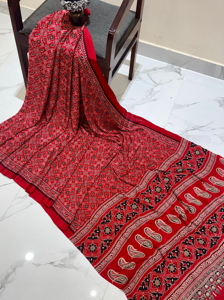 Ruby Red Artisan-Made Ajrakh Saree with Elegant Paisley Border