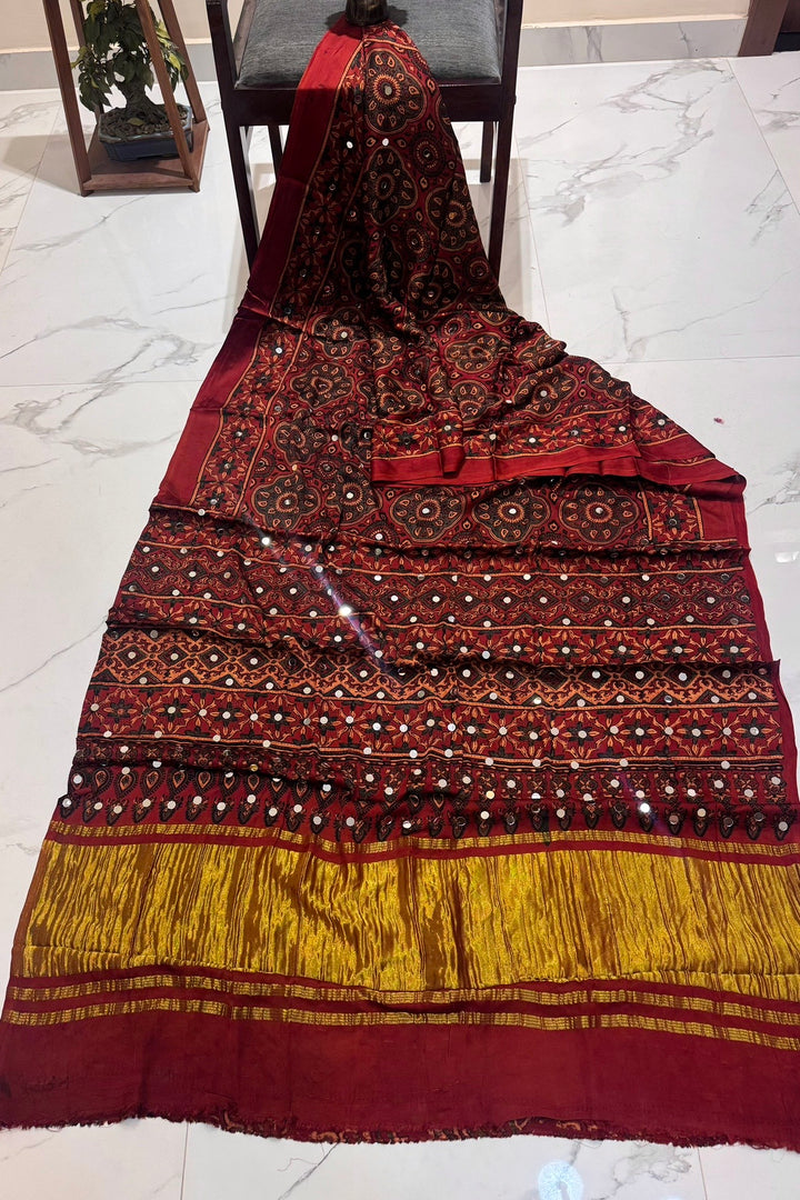 Deep Maroon Modal Silk Ajrakh Handblock Printed Saree with Real Mirror Work & Zari Tissue Pallu