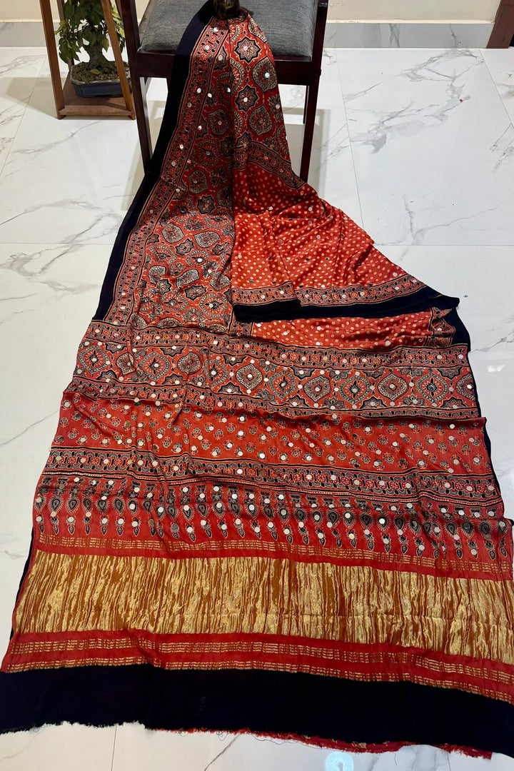 Rust Orange Modal Silk Ajrakh Handblock Printed Saree with Real Mirror Work & Crushed Tissue Pallu