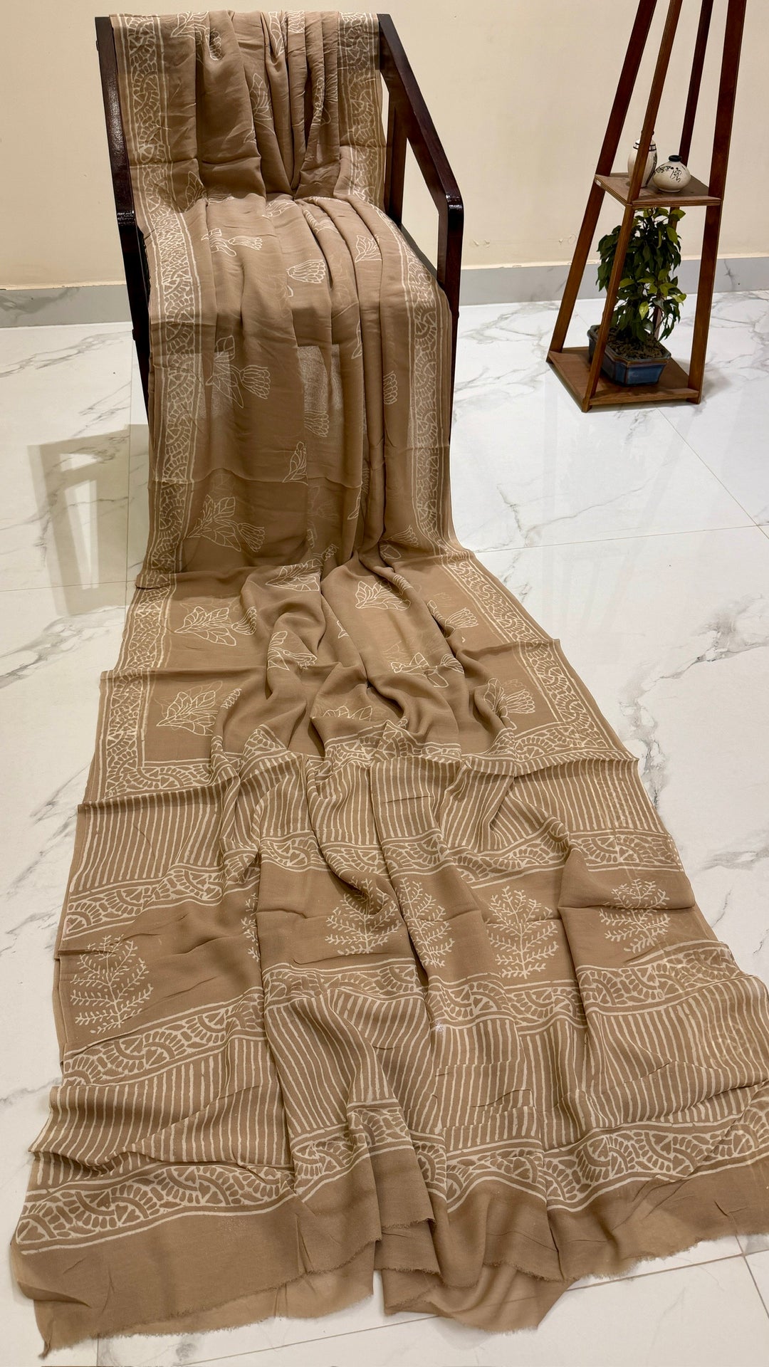Elegant Beige Floral and Striped Pure Georgette Saree